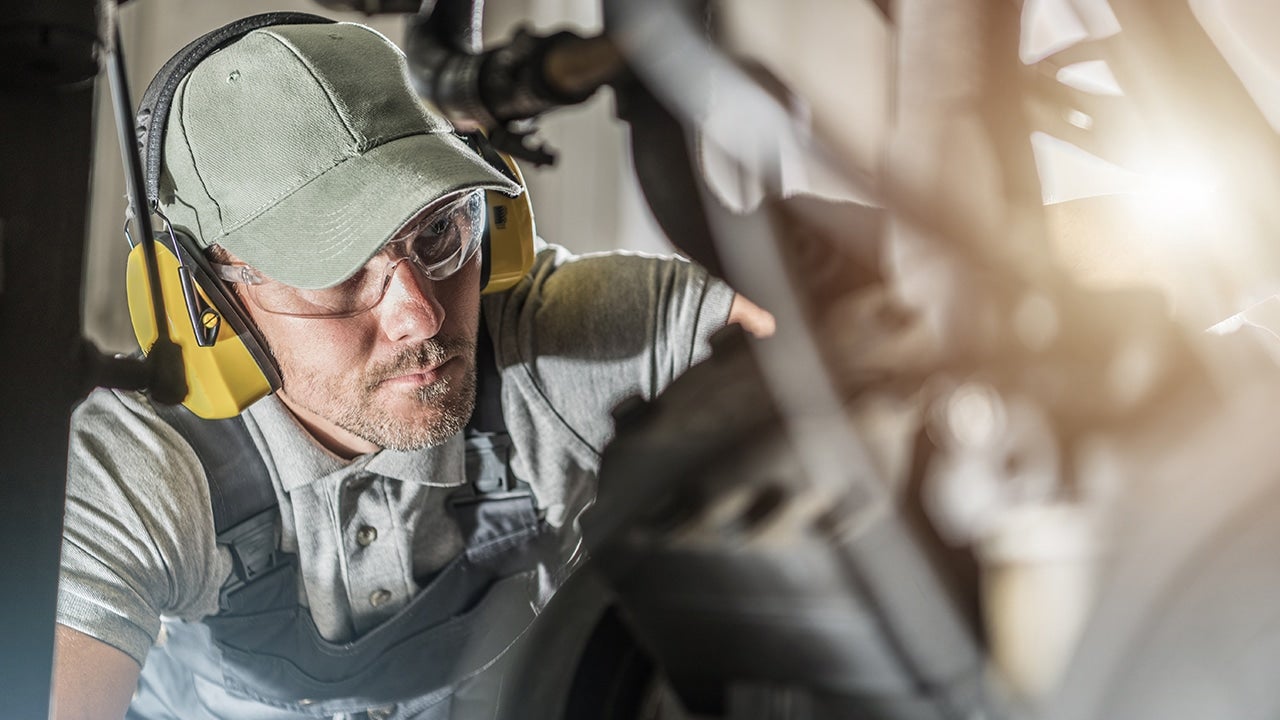 Technicians examining the plan