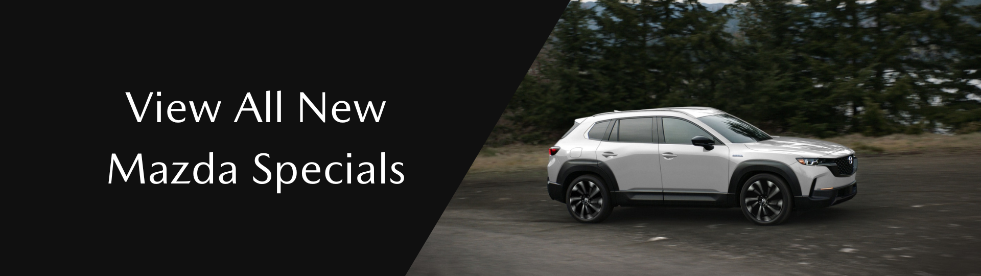 image of mazda suv driving in the woods